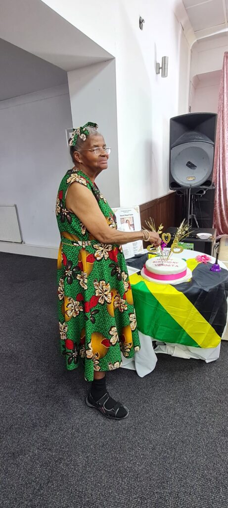 Vernita cutting the Birthday cake