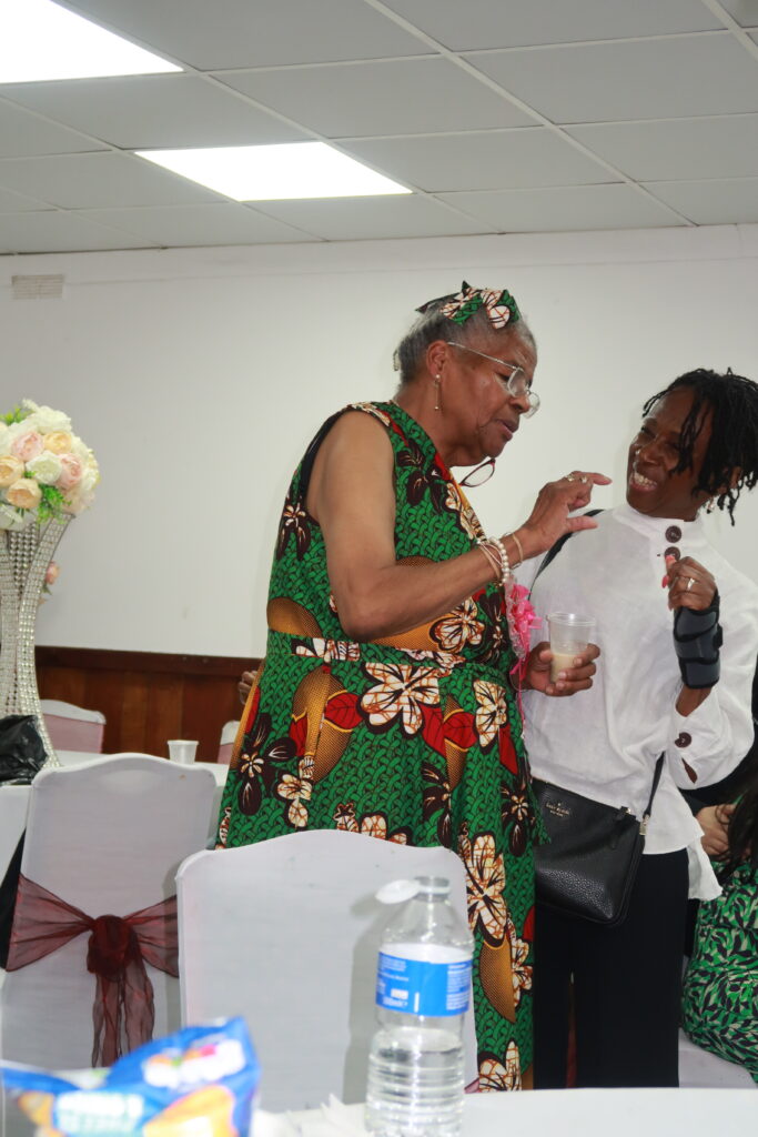 Vernita indicates the size of her tipple